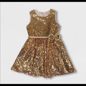 Gold sequins beauty and the beast dress.